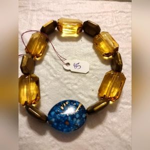 Artemis's Gems custom-made beaded bracelet with large gold and blue beads